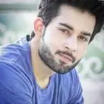 Bilal Ahmed from Islamabad smiling while checking Sunflower Game Pakistan earnings on his phone